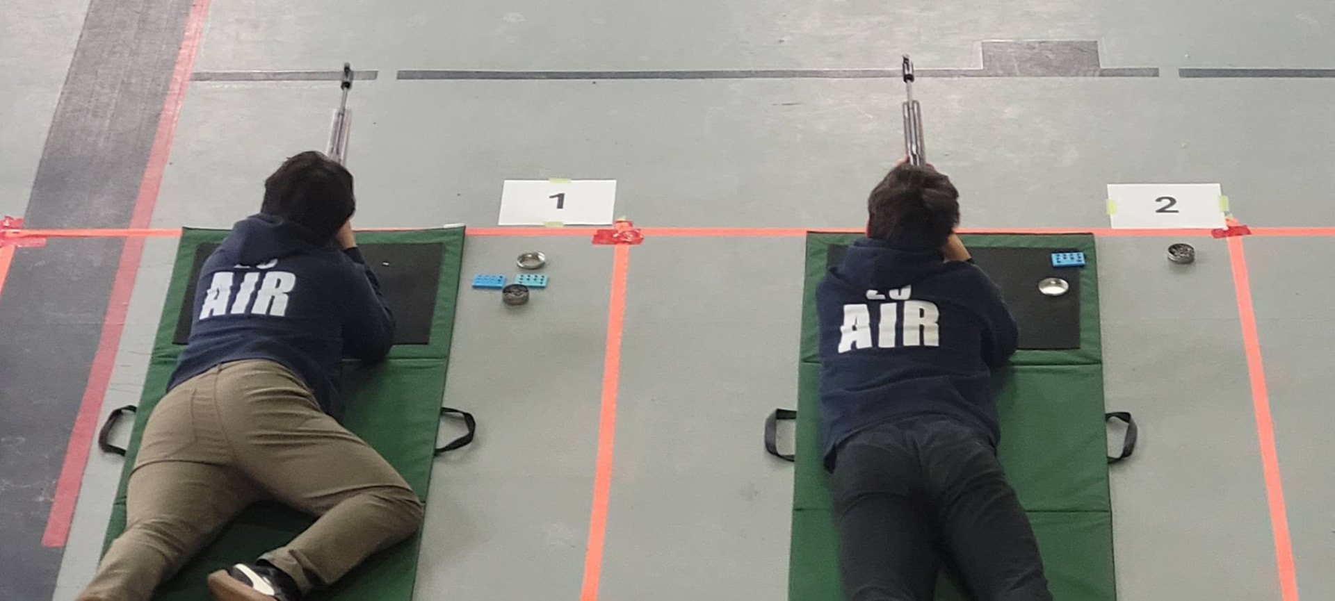 Two 23 Squadron cadets in prone position on a marksmanship range