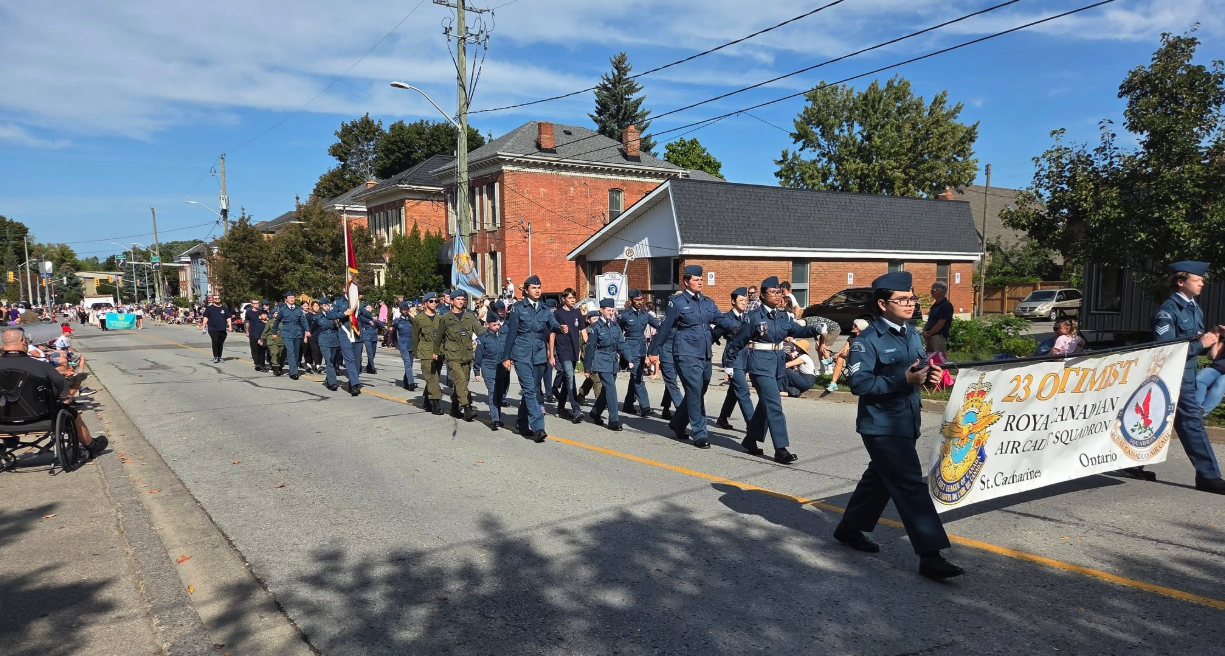 23 Squadron cadets marching in a community parade with the squadron banner